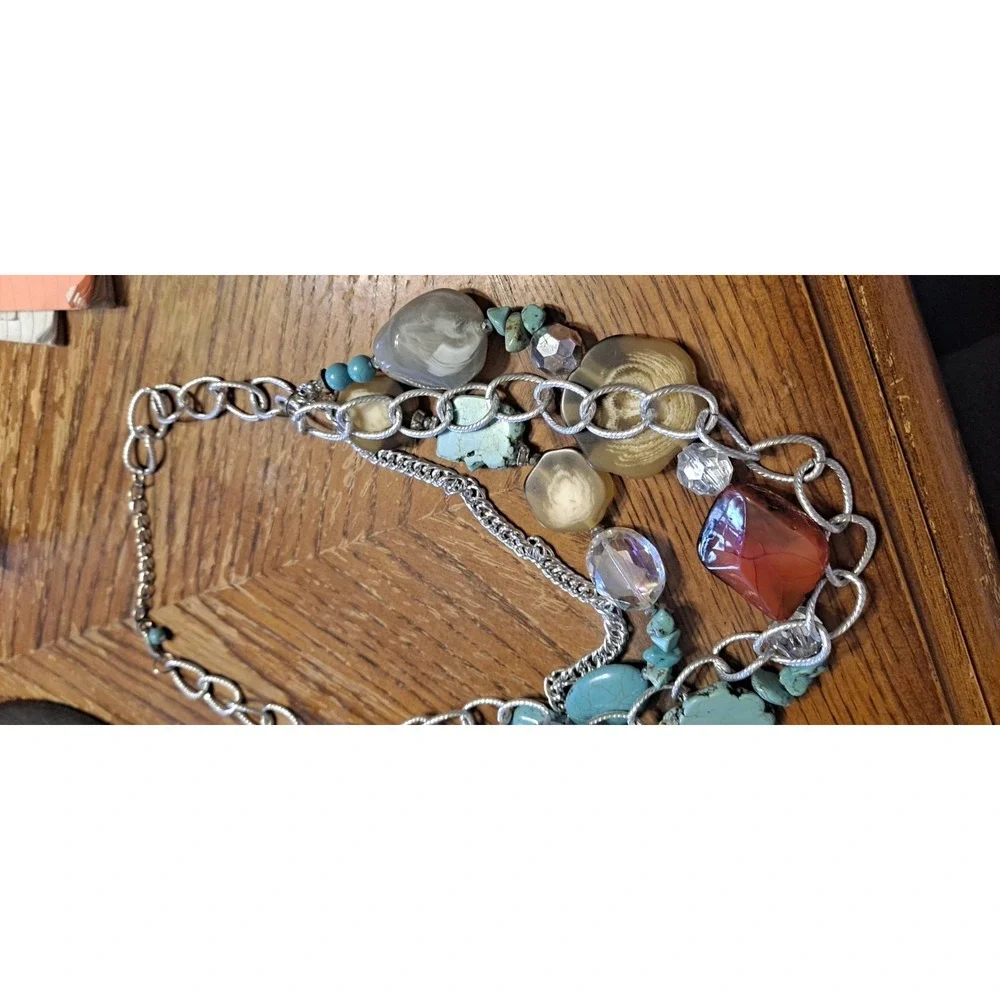 Southwestern-style statement piece featuring multiple strands of silver-toned...